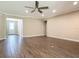 Large living room features hard wood floors, recessed lights and ceiling fan at 19041 Mardi Gras St, Orlando, FL 32833