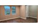 Inviting living room with hardwood floors, natural light, and neutral paint at 19041 Mardi Gras St, Orlando, FL 32833