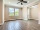 Spacious living room with hardwood floors and a ceiling fan at 19041 Mardi Gras St, Orlando, FL 32833