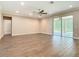 Large living room features hard wood floors, recessed lights, ceiling fan and sliding glass doors at 19041 Mardi Gras St, Orlando, FL 32833