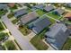 An aerial view of a home with a well-kept yard, a driveway, and mature trees at 2576 Boots Rd, Lakeland, FL 33810