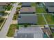 Aerial view of a home with a driveway, lawn, and street access in a residential area at 2576 Boots Rd, Lakeland, FL 33810