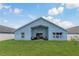 Spacious fenced backyard with a covered patio for outdoor enjoyment at 2576 Boots Rd, Lakeland, FL 33810