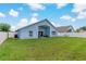Large fenced backyard with a covered patio for relaxing outdoors at 2576 Boots Rd, Lakeland, FL 33810