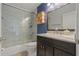 Modern bathroom with vanity, toilet, framed mirror, and a glass-enclosed shower at 2576 Boots Rd, Lakeland, FL 33810