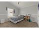 Cozy bedroom with neutral colors, a window for natural light, and a comfortable bed at 2576 Boots Rd, Lakeland, FL 33810