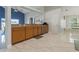 An open-concept kitchen showcases wooden cabinets, stainless steel appliances and smooth countertops at 2576 Boots Rd, Lakeland, FL 33810