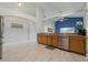 A kitchen with wooden cabinets and stainless steel dishwasher overlooking the breakfast nook at 2576 Boots Rd, Lakeland, FL 33810