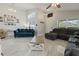 Spacious living room with high ceilings, tile floors, and ample seating at 2576 Boots Rd, Lakeland, FL 33810
