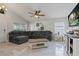 Stylish living room with tile floors, ceiling fan, and plenty of seating at 2576 Boots Rd, Lakeland, FL 33810