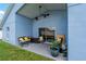 Covered patio featuring outdoor seating and ceiling fan at 2576 Boots Rd, Lakeland, FL 33810