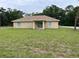 Expansive backyard features sliding glass doors, ideal for outdoor living and entertaining at 5635 Nw 61St Ct, Ocala, FL 34482