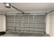 Inside garage view of garage door mechanism, with a bare concrete floor at 5635 Nw 61St Ct, Ocala, FL 34482