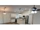 Modern kitchen featuring stainless steel appliances, granite countertops, and ample cabinet space at 5635 Nw 61St Ct, Ocala, FL 34482