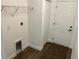 Functional laundry room with convenient access to storage and exterior doors at 5635 Nw 61St Ct, Ocala, FL 34482