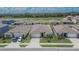 New homes in a suburban neighborhood showcasing well-maintained landscaping and driveways at 3628 Diving Dove Ln, Bartow, FL 33830