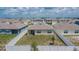 Aerial view of the backyard showcasing the privacy fence and proximity to neighboring homes at 3628 Diving Dove Ln, Bartow, FL 33830