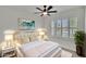 Bright bedroom with white trim, plush rug and a bed with gold accents at 3628 Diving Dove Ln, Bartow, FL 33830