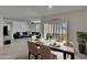 This dining room features modern decor and is adjacent to the living room and patio at 3628 Diving Dove Ln, Bartow, FL 33830