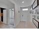 Bright entryway featuring tiled floors and decorative wall art, leading into the home at 3628 Diving Dove Ln, Bartow, FL 33830