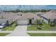 Well maintained single-Gathering home featuring a well manicured lawn and two-car garage at 3628 Diving Dove Ln, Bartow, FL 33830