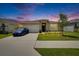 Charming single-story home featuring a well-manicured lawn, and a freshly painted, welcoming facade at 3628 Diving Dove Ln, Bartow, FL 33830