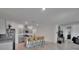 Open-concept kitchen with an island, stainless steel appliances, and modern gray cabinetry at 3628 Diving Dove Ln, Bartow, FL 33830