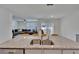 Kitchen island featuring granite countertops and stainless steel sink, blending into the living area at 3628 Diving Dove Ln, Bartow, FL 33830