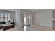 Bright living room with tile flooring, sliding doors to the patio, and a comfortable sectional sofa at 3628 Diving Dove Ln, Bartow, FL 33830