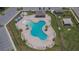 Resort-style community pool featuring lounge chairs, umbrellas, and a covered pavilion at 3628 Diving Dove Ln, Bartow, FL 33830