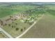 The property's residence has a circular driveway and is surrounded by mature trees on a large green lot at 9419 Alturas Babson Park Cutoff Rd, Bartow, FL 33830