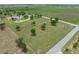 Aerial view of the vast property features the home, garage, and extensive landscaping at 9419 Alturas Babson Park Cutoff Rd, Bartow, FL 33830