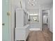 A pristine bathroom featuring a glass shower, vanity and a view down the hall at 9419 Alturas Babson Park Cutoff Rd, Bartow, FL 33830