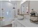 Modern bathroom featuring a white vessel sink, gold fixtures, glass enclosed shower and decorative accents at 9419 Alturas Babson Park Cutoff Rd, Bartow, FL 33830