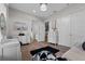 Bright bedroom features stylish vanity, wood floors, and multiple doors at 9419 Alturas Babson Park Cutoff Rd, Bartow, FL 33830