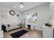 Bright bedroom features stylish vanity, wood floors, and elegant furnishings at 9419 Alturas Babson Park Cutoff Rd, Bartow, FL 33830