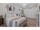 Charming bedroom featuring a bed with decorative pillows, hardwood floors and rustic decor at 9419 Alturas Babson Park Cutoff Rd, Bartow, FL 33830