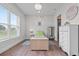 Bright bedroom features stylish decor, wood floors, and elegant lighting at 9419 Alturas Babson Park Cutoff Rd, Bartow, FL 33830