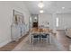 Dining room with hardwood floors, an area rug, chandelier lighting and a large wooden table at 9419 Alturas Babson Park Cutoff Rd, Bartow, FL 33830