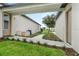 Landscaped walkway between buildings, featuring well-maintained grass and manicured plants at 9419 Alturas Babson Park Cutoff Rd, Bartow, FL 33830