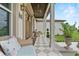 Charming front porch with comfortable seating, patterned tile, and inviting decor at 9419 Alturas Babson Park Cutoff Rd, Bartow, FL 33830