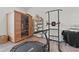 Home gym featuring modern equipment, including a sauna and a pull-up bar, perfect for a complete workout at 9419 Alturas Babson Park Cutoff Rd, Bartow, FL 33830