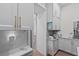 Kitchen with white cabinetry and modern appliances, including a coffee maker and a smoothie maker at 9419 Alturas Babson Park Cutoff Rd, Bartow, FL 33830