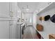 Bright laundry room with white cabinetry, modern washer and dryer, and stylish decor at 9419 Alturas Babson Park Cutoff Rd, Bartow, FL 33830