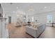 Spacious living room featuring a chandelier, hardwood flooring, and a comfortable seating arrangement at 9419 Alturas Babson Park Cutoff Rd, Bartow, FL 33830