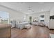 Spacious main bedroom with hardwood floors, sitting area, and abundant natural light at 9419 Alturas Babson Park Cutoff Rd, Bartow, FL 33830