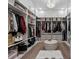 Spacious walk-in closet features built in shelving and ottoman seating at 9419 Alturas Babson Park Cutoff Rd, Bartow, FL 33830