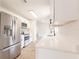 Bright kitchen featuring stainless steel appliances, quartz countertops, and a seamless design for a modern look at 1856 Laredo Dr, Deltona, FL 32738