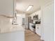 Modern kitchen boasting stainless steel appliances, quartz countertops, updated cabinetry, and ample storage space at 1856 Laredo Dr, Deltona, FL 32738