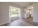 Bright, remodeled kitchenette features modern appliances, white cabinetry, and a large window for natural light at 1856 Laredo Dr, Deltona, FL 32738